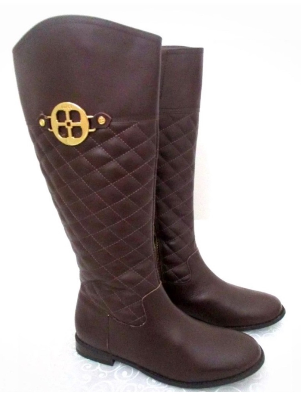 Iman Brown Quilted Knee-High Riding Boots with gold logo medallion